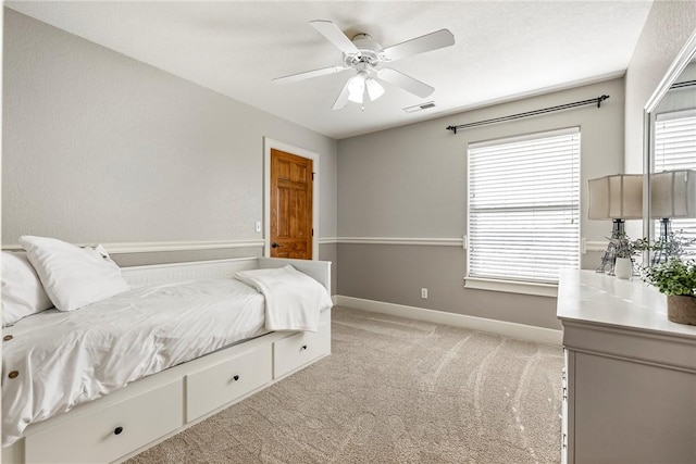 bedroom with light colored carpet and ceiling fan