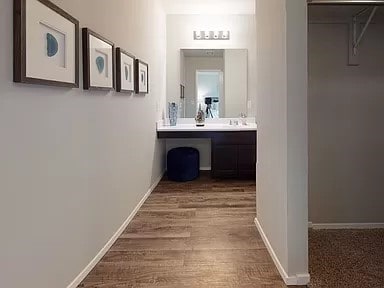 hallway with hardwood / wood-style flooring