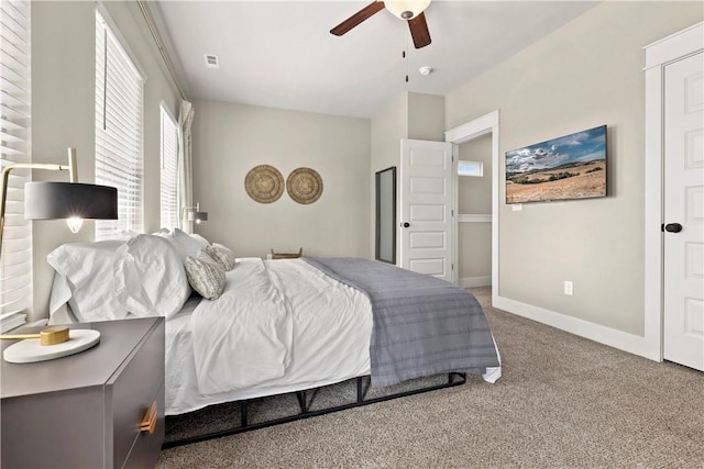 carpeted bedroom with ceiling fan