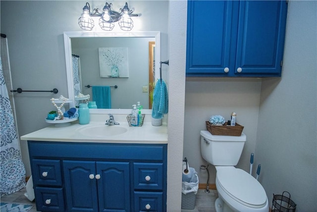 bathroom featuring vanity and toilet