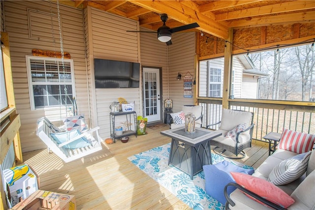 deck featuring an outdoor living space and ceiling fan