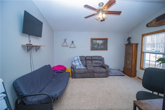 living room with vaulted ceiling, carpet floors, and ceiling fan