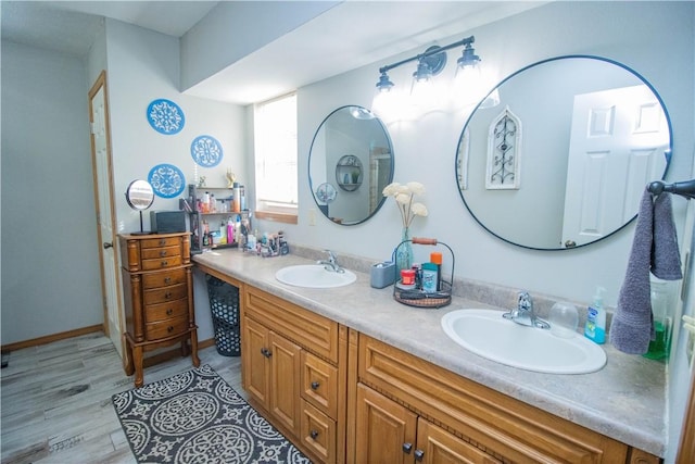 bathroom featuring vanity and hardwood / wood-style flooring