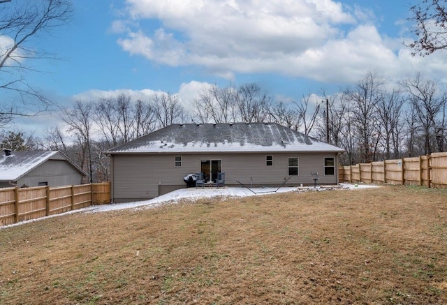 back of house with a patio area and a lawn