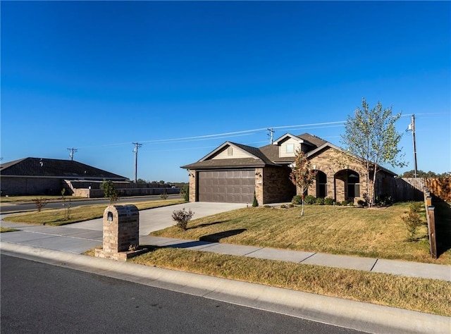 ranch-style home featuring a garage and a front lawn