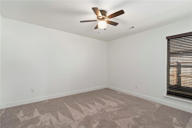 carpeted empty room with ceiling fan