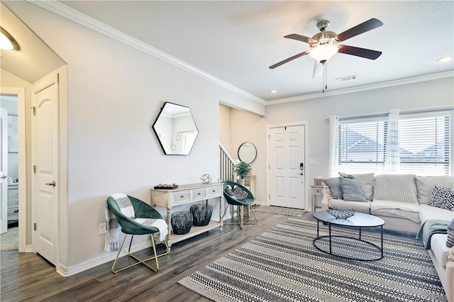 living room with ceiling fan, ornamental molding, and dark hardwood / wood-style floors