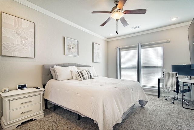 carpeted bedroom with ornamental molding and ceiling fan