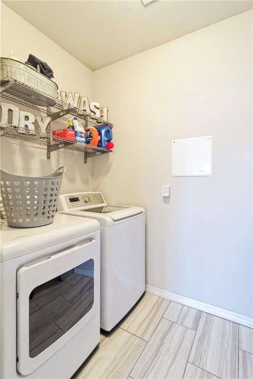 laundry area featuring washing machine and dryer