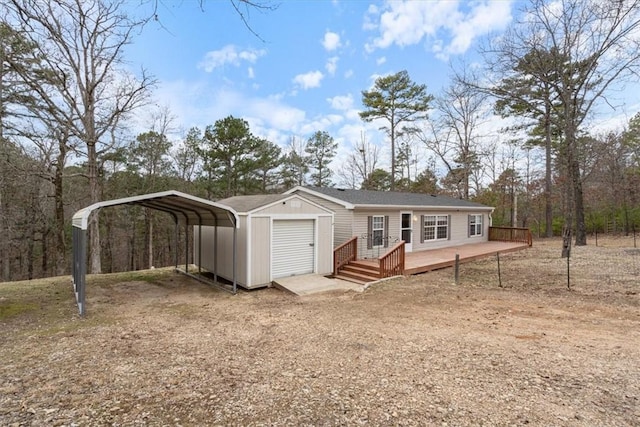 manufactured / mobile home with a carport and a deck