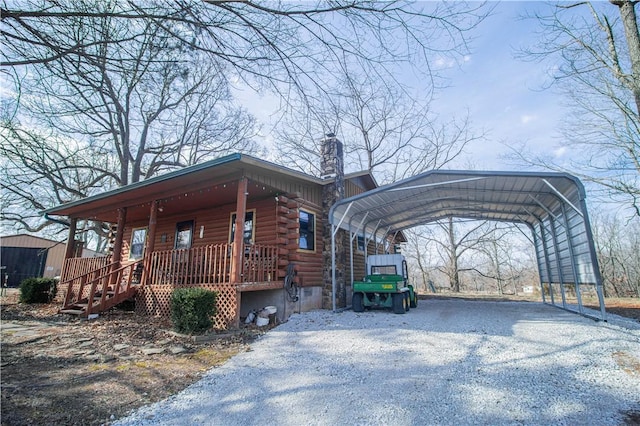 view of front of house with a carport and covered porch