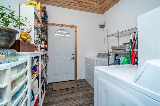 laundry area featuring washer and clothes dryer and dark hardwood / wood-style floors