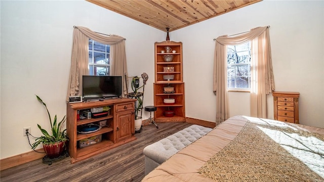 bedroom with dark wood-type flooring, wooden ceiling, and vaulted ceiling