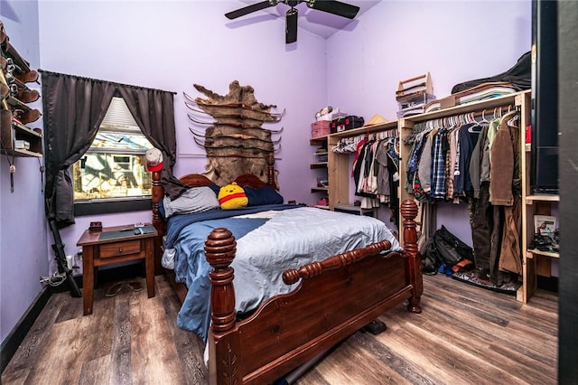 bedroom featuring hardwood / wood-style flooring and ceiling fan