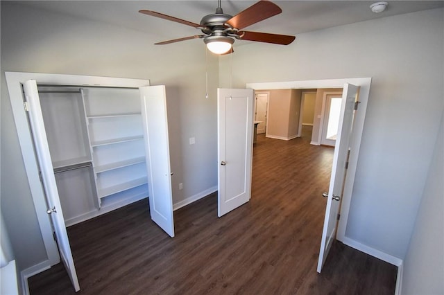 unfurnished bedroom with ceiling fan, dark hardwood / wood-style flooring, and a closet