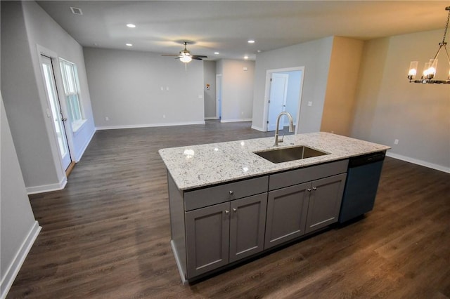 kitchen featuring sink, gray cabinets, black dishwasher, pendant lighting, and light stone countertops