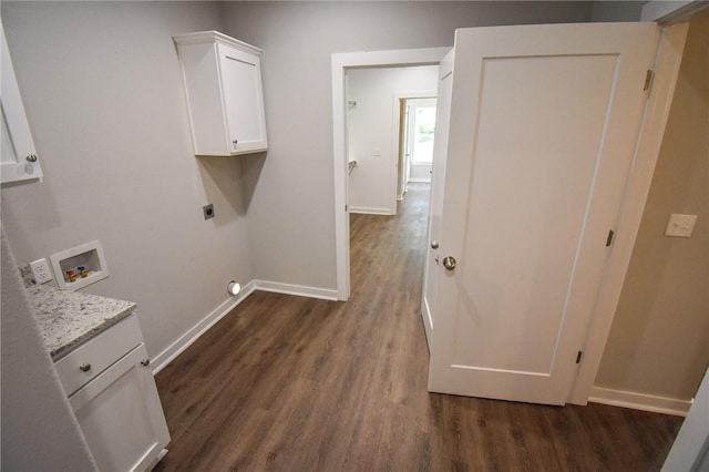 laundry area with washer hookup, electric dryer hookup, dark hardwood / wood-style floors, and cabinets