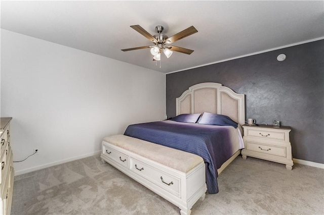 bedroom featuring ceiling fan and light carpet