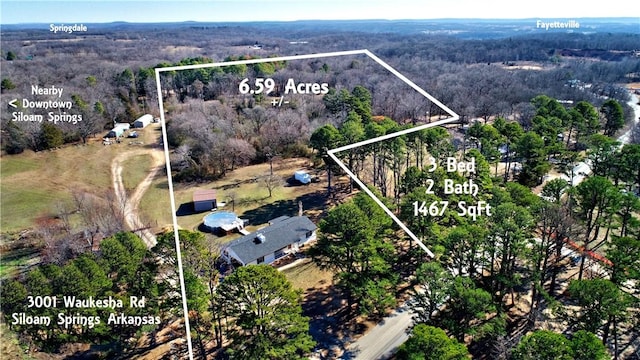 3001 Waukesha Rd, Siloam Springs, AR 72761 - aerial overview of property's location featuring a heavily wooded area and property boundaries highlighted