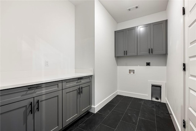 laundry area featuring cabinets, electric dryer hookup, and washer hookup