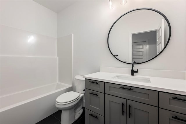 full bathroom with shower / tub combination, vanity, tile patterned floors, and toilet