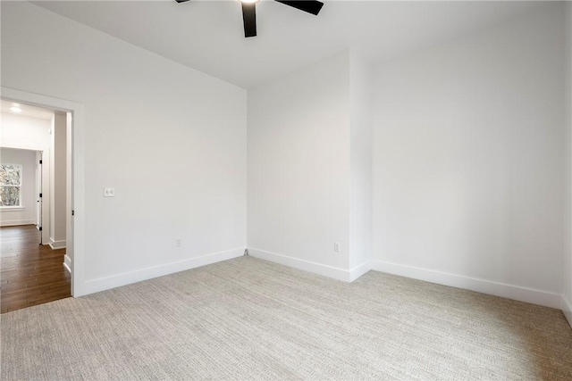 spare room with lofted ceiling, ceiling fan, and carpet flooring