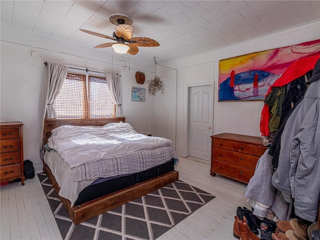 bedroom featuring ceiling fan and light hardwood / wood-style floors