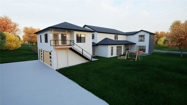 rear view of house featuring a garage and a lawn