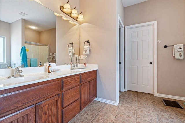 bathroom with vanity, an enclosed shower, and tile patterned floors