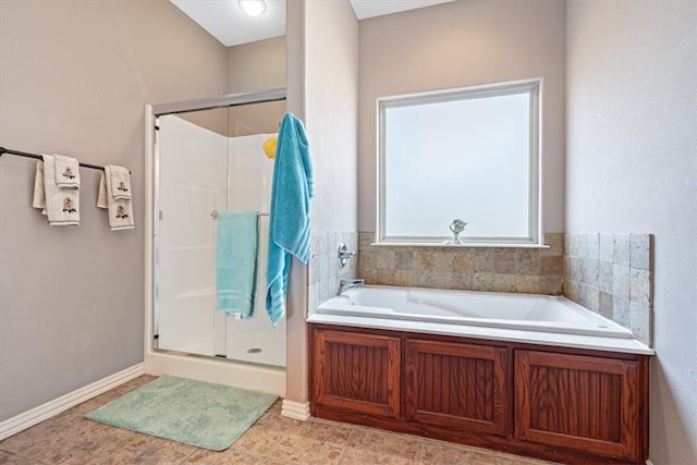 bathroom featuring independent shower and bath and tile patterned flooring