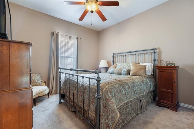 bedroom with light colored carpet and ceiling fan