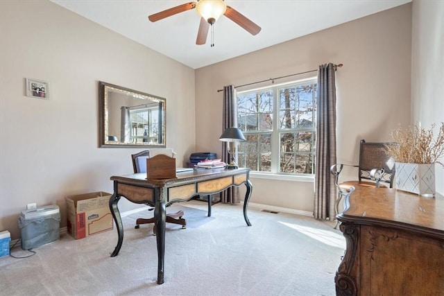 carpeted office featuring ceiling fan