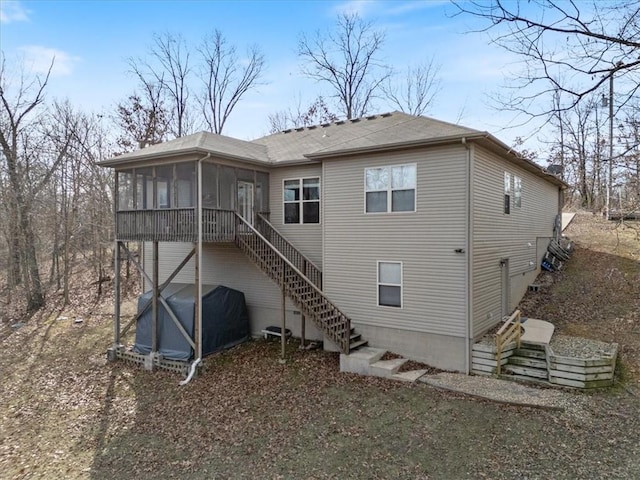 back of house with a sunroom