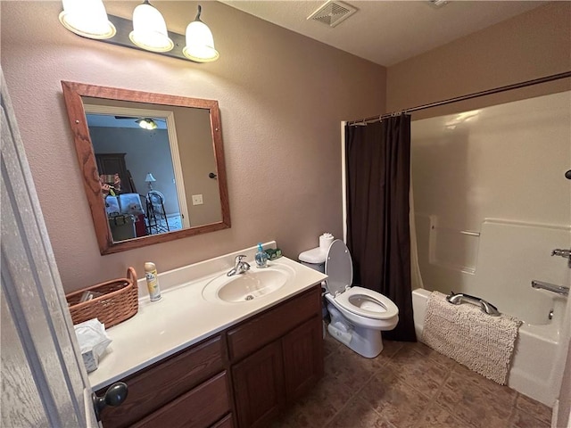 full bathroom featuring tile patterned flooring, vanity, shower / tub combo, and toilet