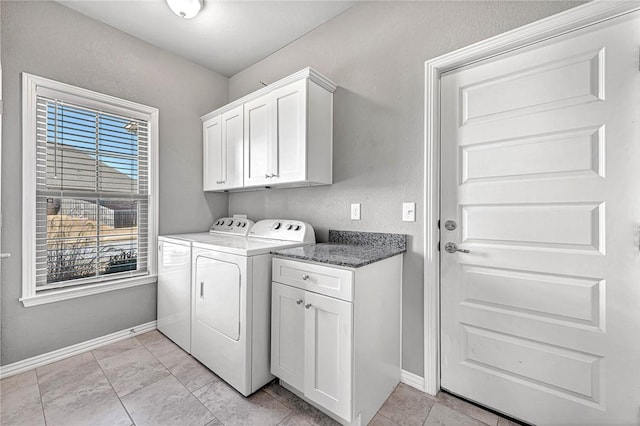 laundry room featuring cabinets and independent washer and dryer