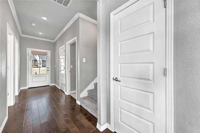 foyer with crown molding and dark hardwood / wood-style floors