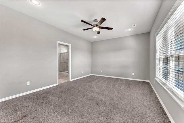 empty room with carpet floors and ceiling fan