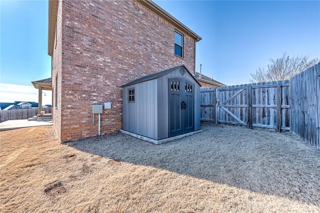 exterior space featuring a patio and a storage shed