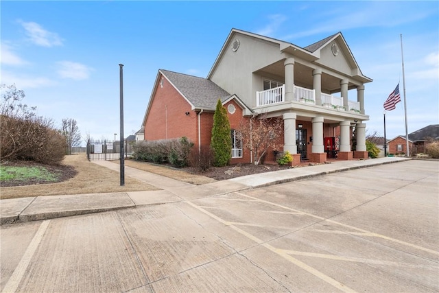 view of front of home featuring a balcony