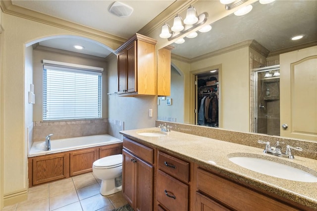 full bathroom featuring tile patterned floors, toilet, vanity, ornamental molding, and independent shower and bath