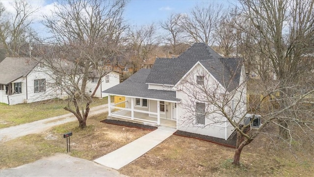 view of front of property with a front yard and covered porch