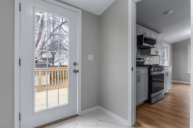 doorway to outside featuring a wealth of natural light