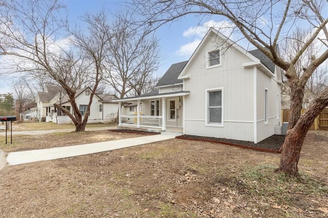 view of front of house with cooling unit and covered porch