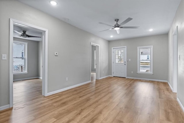 interior space with ceiling fan and light hardwood / wood-style flooring