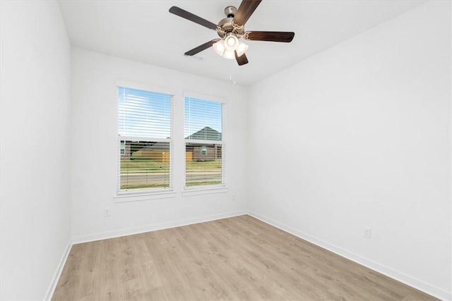 unfurnished room featuring ceiling fan and light wood-type flooring