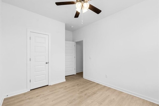 unfurnished bedroom with a closet, ceiling fan, and light hardwood / wood-style floors