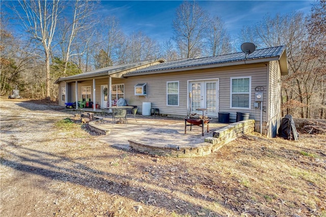 back of property with french doors and a patio area