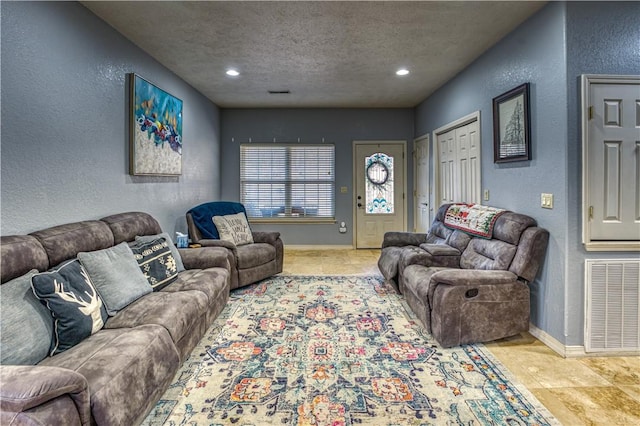 living room with a textured ceiling