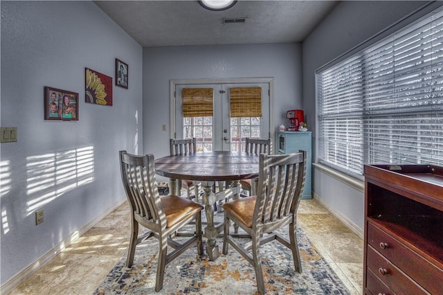 dining area featuring french doors