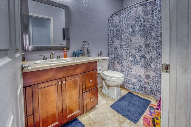 bathroom featuring a shower with curtain, vanity, and toilet